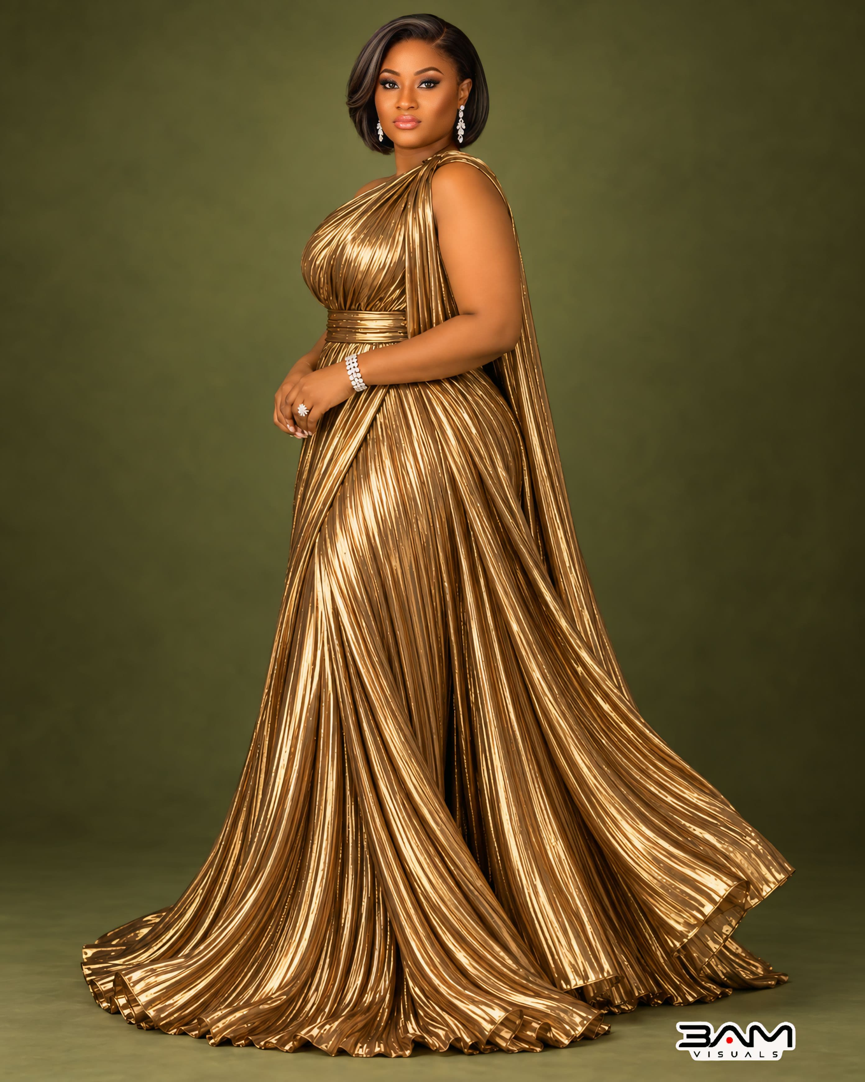 Full-length portrait of Adeseun Oyeneye in a gold gown